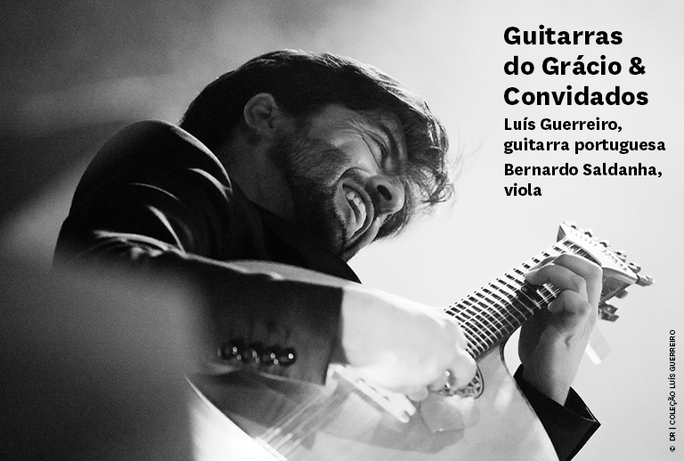 Imagem com guitarrista a tocar guitarra