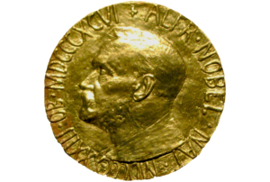 Imagem da medalha de ouro correspondente ao Prémio Nobel.