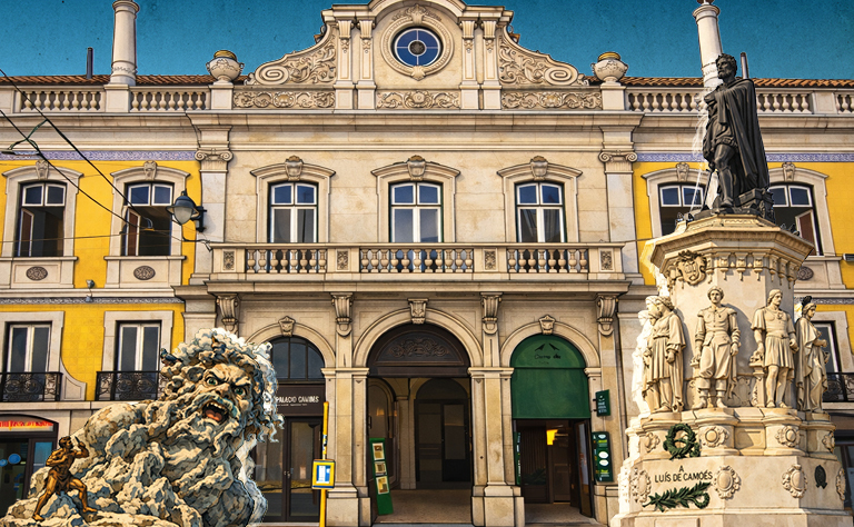 Imagem com uma das fachadas da biblioteca e dois monumentos.